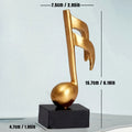 Escultura Decorativa de Nota Musical em Resina Dourada